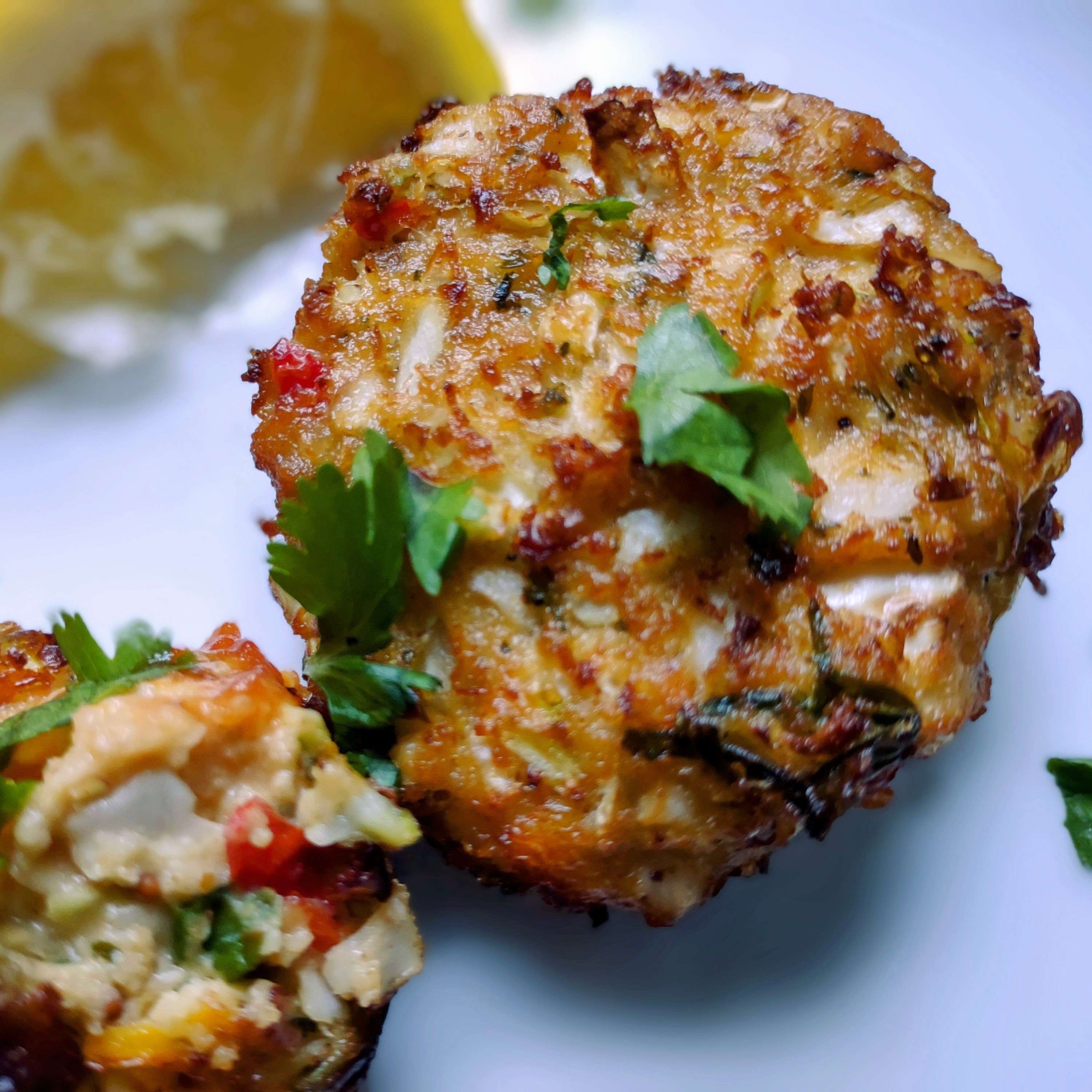 A plate of golden brown cab cakes.