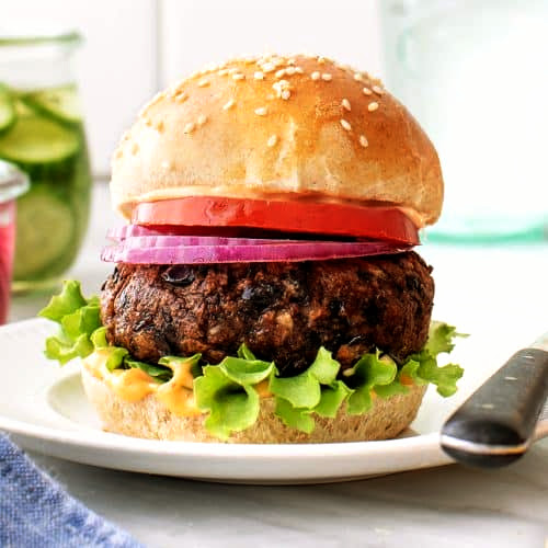 A cooked chipotle black bean burger on a bun.