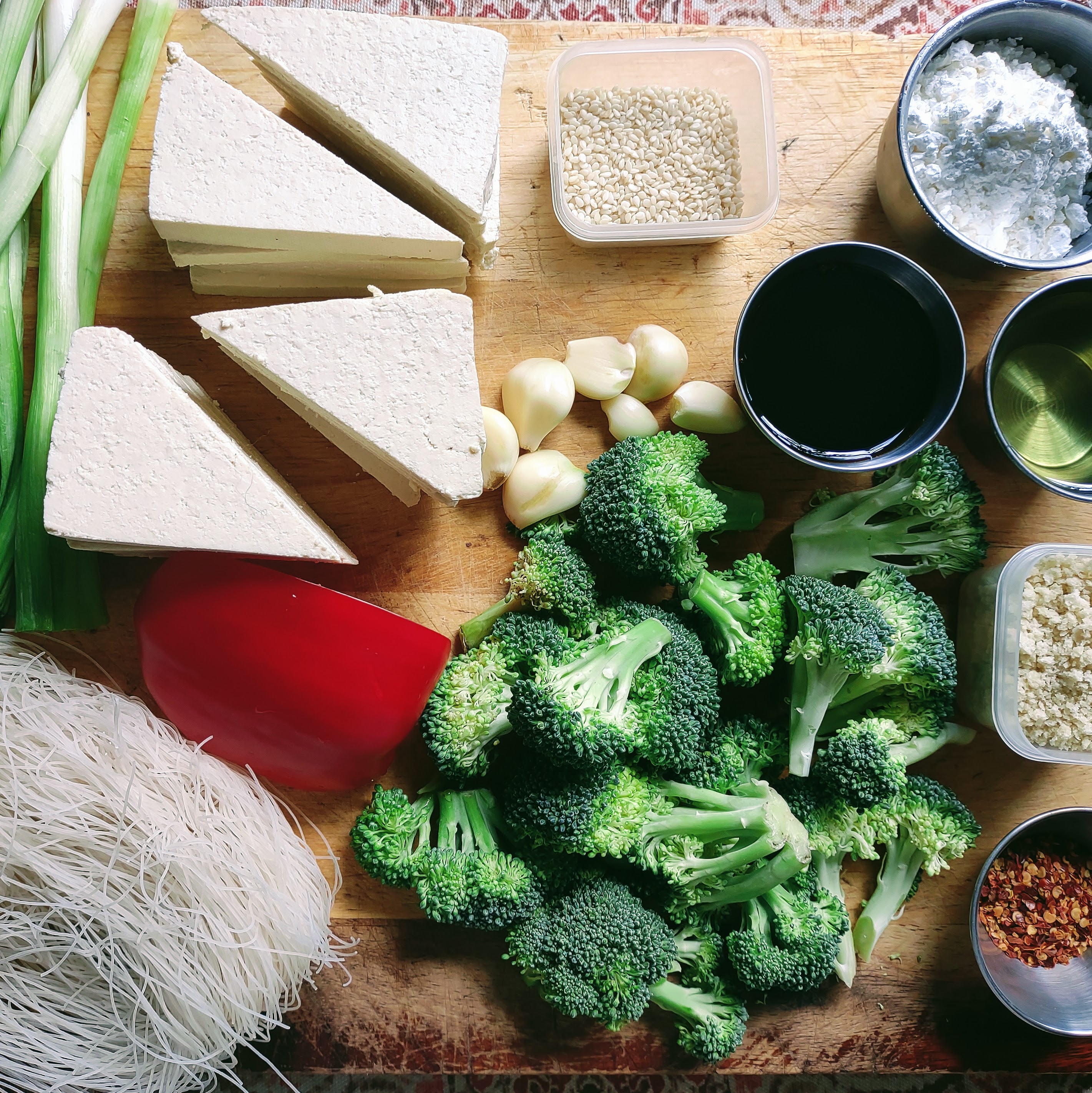 Tofu being coated in a seasoned mixture.